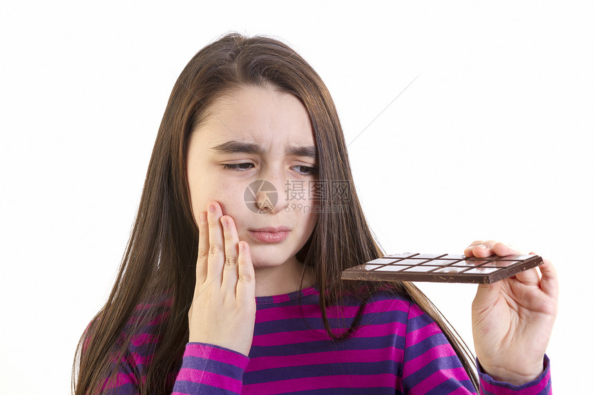 有牙痛的女童疼痛女孩医疗影棚疾病糖果条甜食食物表情悲伤图片
