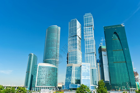 现代系统扩张者反射太阳天空建筑玻璃商业技术蓝色建筑学房子背景图片