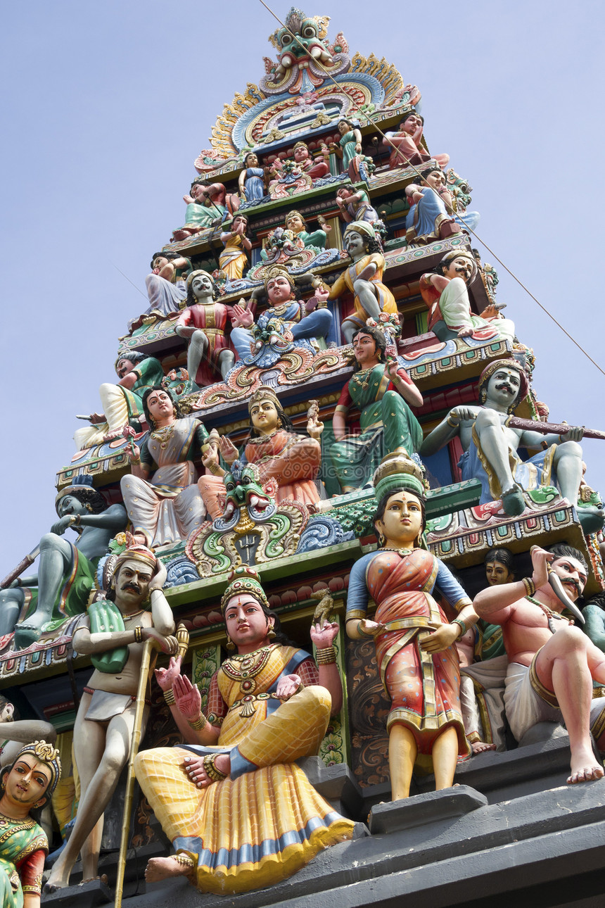 新加坡印度教寺庙雕塑旅行地标宗教崇拜天空建筑学蓝色奶牛红色图片