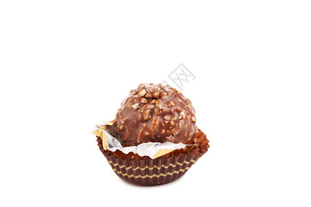 巧克力金蛋和坚果飞碟食物糖果白色糕点松露甜点高清图片