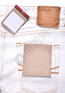 带价格标签的拖车服装品牌白色纺织品空白牛仔布棕色牛仔裤细绳材料背景图片