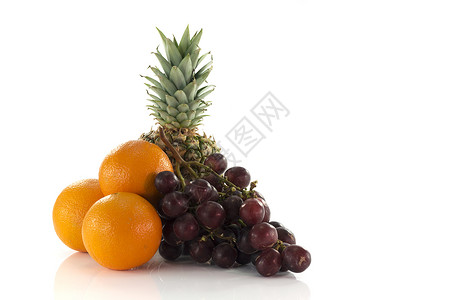 红葡萄橙和菠萝背景图片