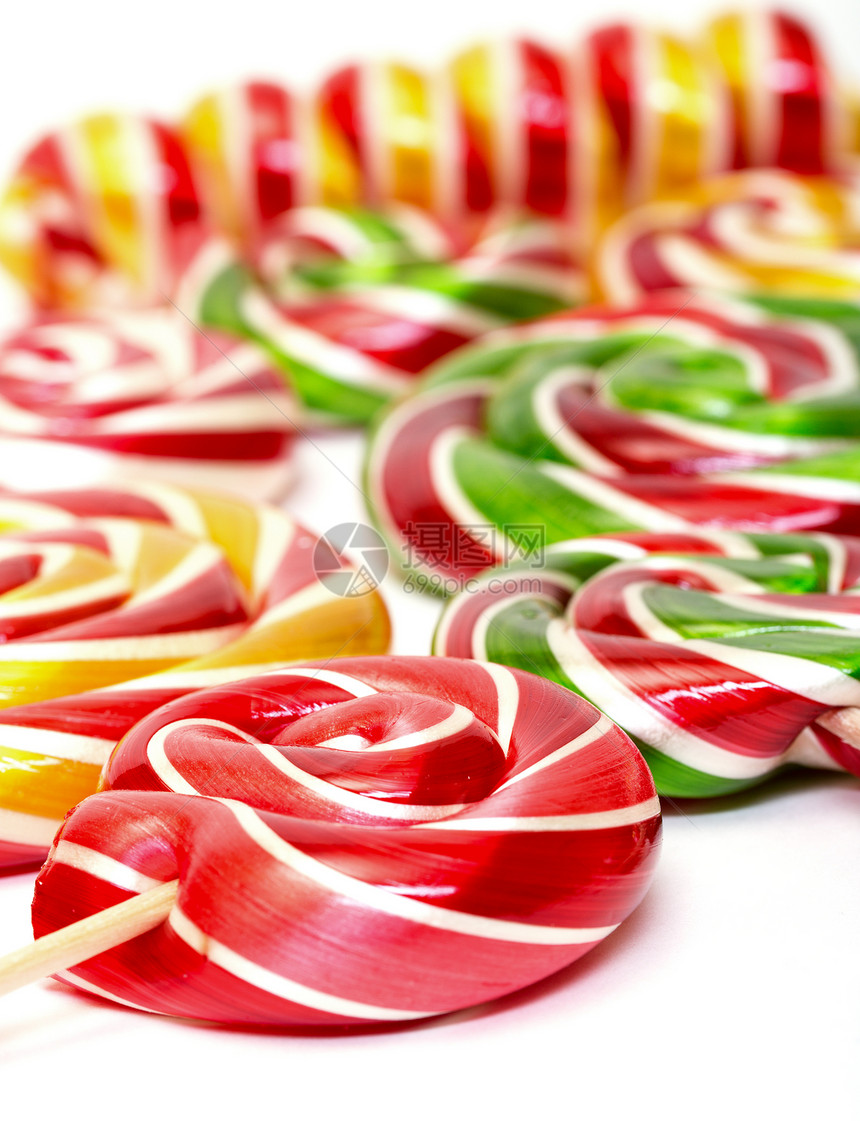 多色棒棒棒糖童年甜点漩涡白色条纹圆形食物红色绿色团体图片