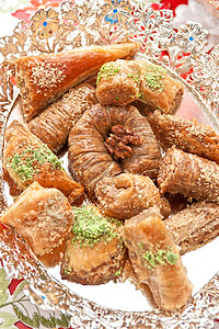 土耳其语甜点火鸡盘子脚凳核桃美食蜂蜜面包糕点糖果开心果巴卡拉高清图片素材
