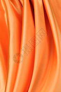 折成橙色丝绸背景图片