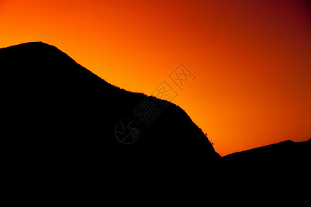 橙色日落调色黑色橙子岩石照片背景图片