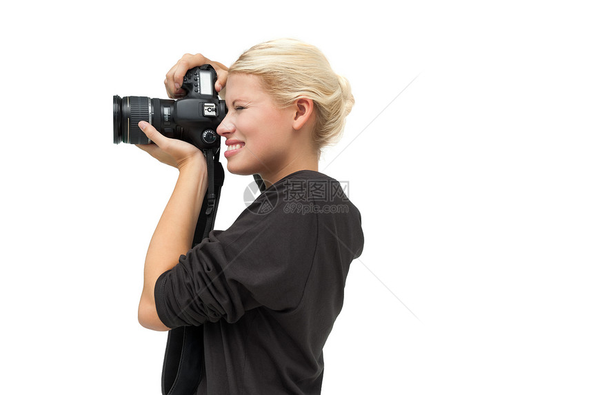 美丽的女摄影师闲暇专注女性单反女士爱好金发女郎头发金发摄影图片