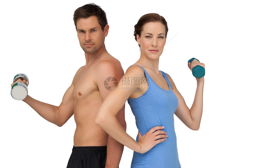 配有哑铃的适龄年轻夫妇运动背心重量训练调子护理男性身体运动服女士举重图片