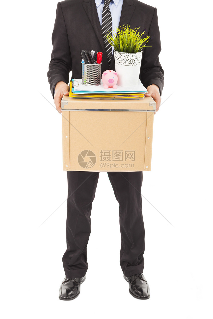 携带一个盒子的被解雇商务人士图片