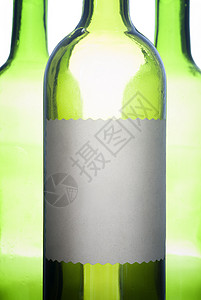 绿色酒瓶加标签背景图片
