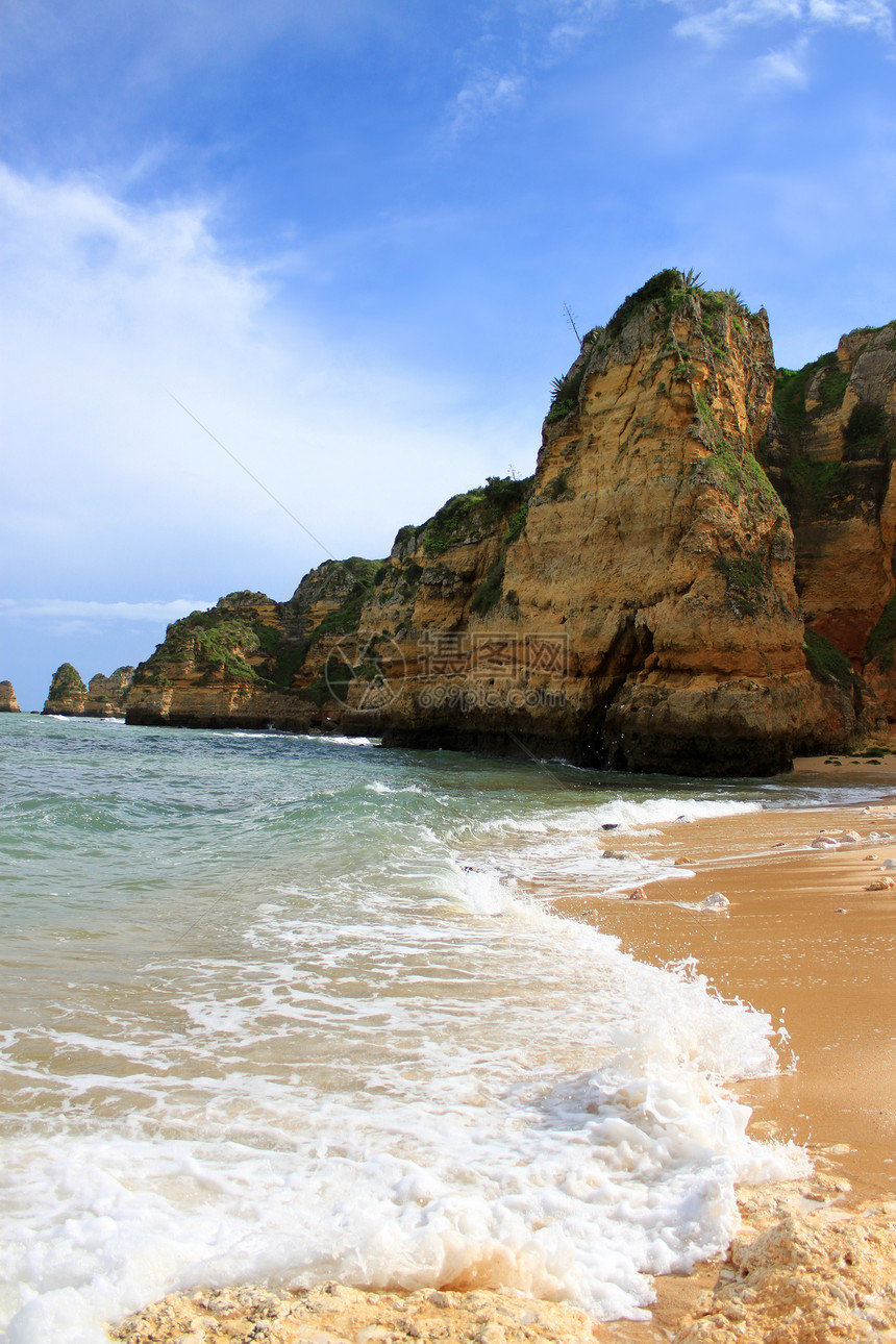 葡萄牙拉各斯悬崖旅游蓝色岩石海岸晴天旅行海岸线海滩海洋图片