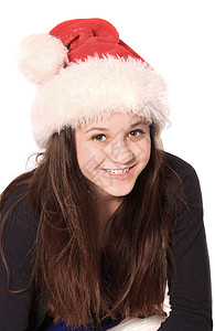 戴着圣诞帽子的女孩红色庆典棕色女性喜悦头发青少年微笑孩子白色背景图片
