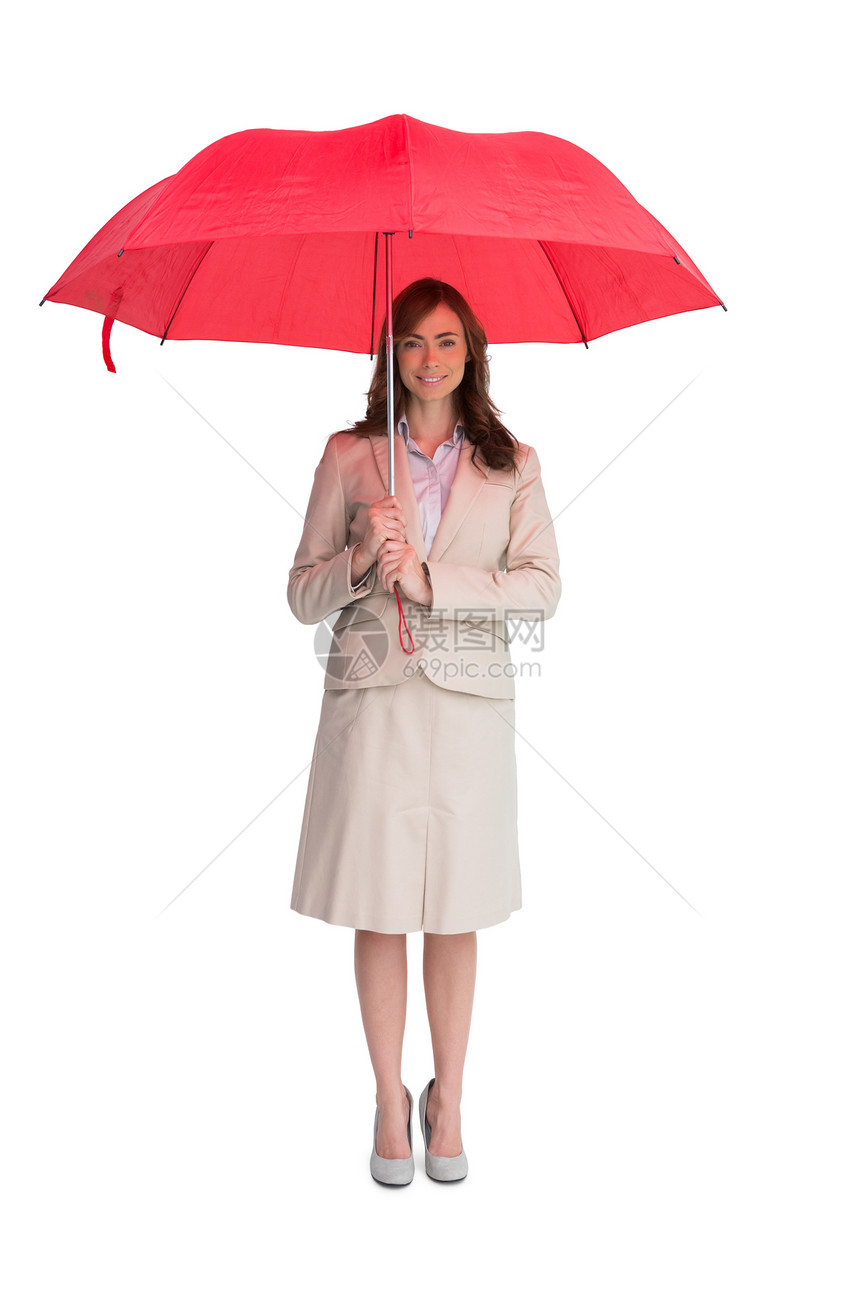 持有红色伞的有吸引力的商业妇女图片