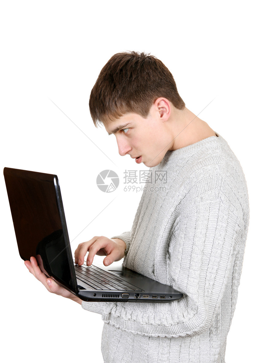 有笔记本机的忙碌青少年手指欲望笔记本互联网男性白色展示键盘热情社会图片