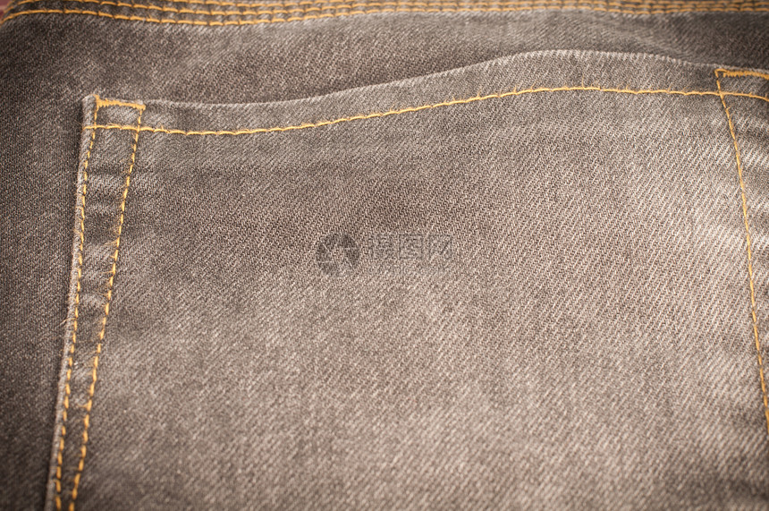 近身牛仔裤纹理青年裤子缝纫装饰靛青服装风格灰色织物材料图片