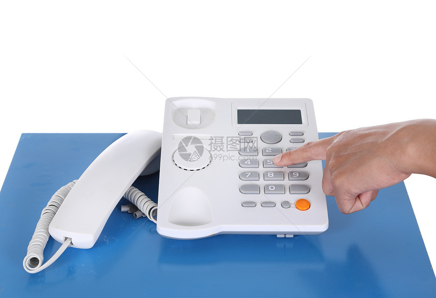 手持电话在表格上桌子红色指甲女士键盘操作员蓝色顾客秘书工作图片