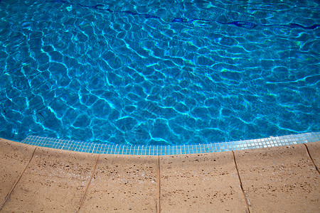 无边界游泳池游泳池阳光气泡娱乐温泉旅行圆圈水池闲暇边界蓝色背景