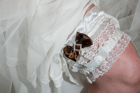 新娘的Garter带蕾丝婚礼裙子腰带袜带丝带背景图片