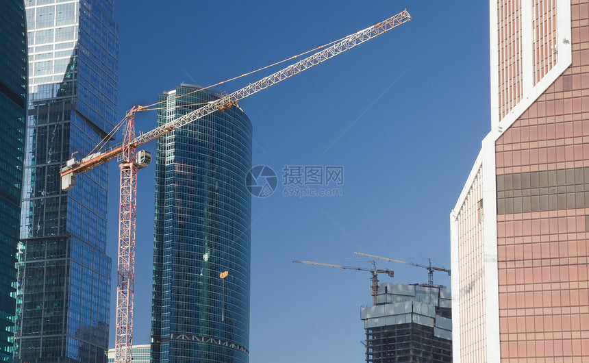 吊起起重机工业城市建筑物建筑学吊装建筑商业天空摩天大楼蓝色图片