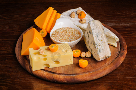 奶酪板蓝色坚果静物芝麻产品奶制品水果模具食物午餐背景图片