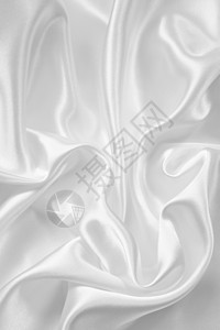 平滑优雅的白色丝绸涟漪折痕材料织物布料海浪银色曲线纺织品投标背景图片
