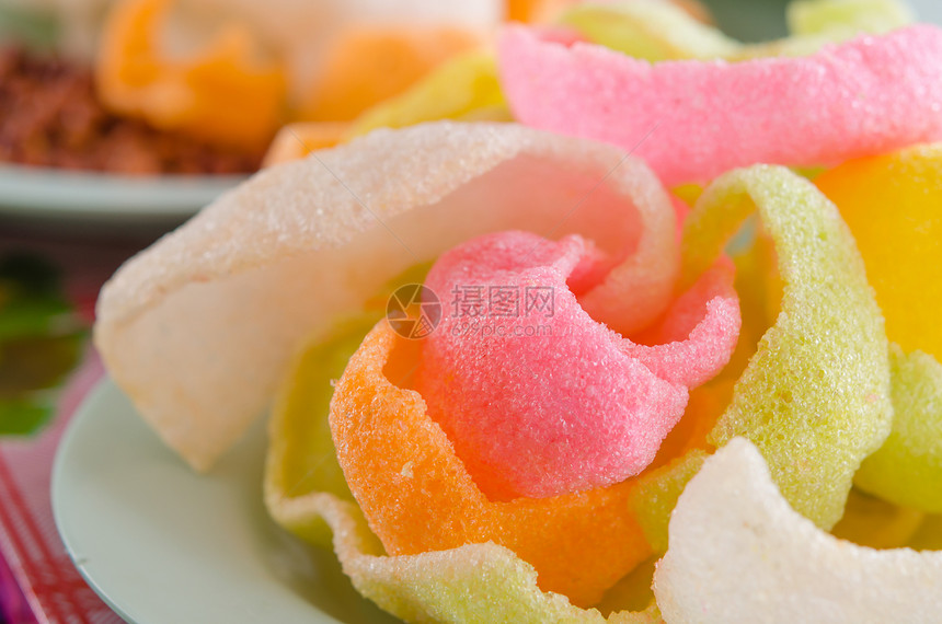 大米米果食物粮食橙子小吃油炸谷物粉色黄色绿色图片