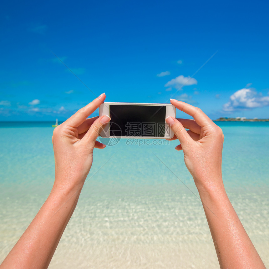 特写电话背景背景的绿绿海摄影师手机海洋假期细胞享受海滩时间太阳热带图片