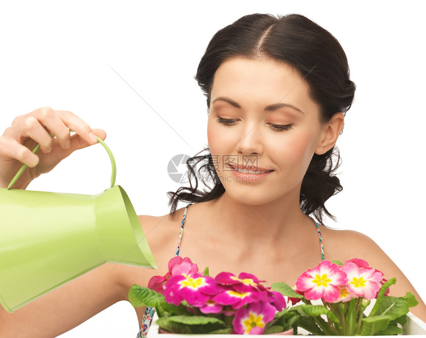 家庭主妇在饮用水和饮水罐中花朵家务温室妻子植物学家施肥女孩花园农村房子花盆图片