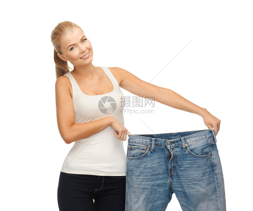 穿着大裤子的运动妇女饮食衣服腰部腰围组织重量微笑燃烧成功福利图片