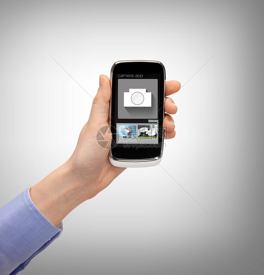 使用智能手机显示应用程序的手举手照片细胞相机全世界触摸屏按钮广播技术工具电话图片