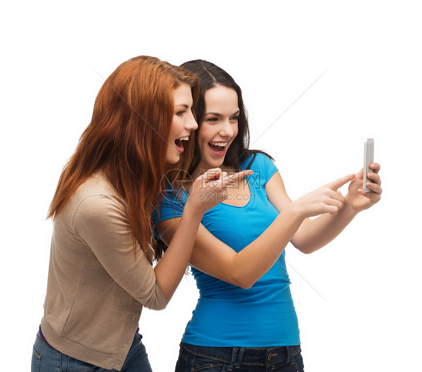 两个带着智能手机的笑笑青少年视频乐趣技术社会友谊互联网队友闺蜜手指娱乐图片