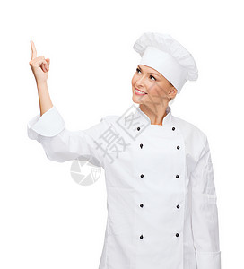 笑着的女厨师指着男儿女士成人管理人员食谱手指餐厅食物职业广告面包背景图片