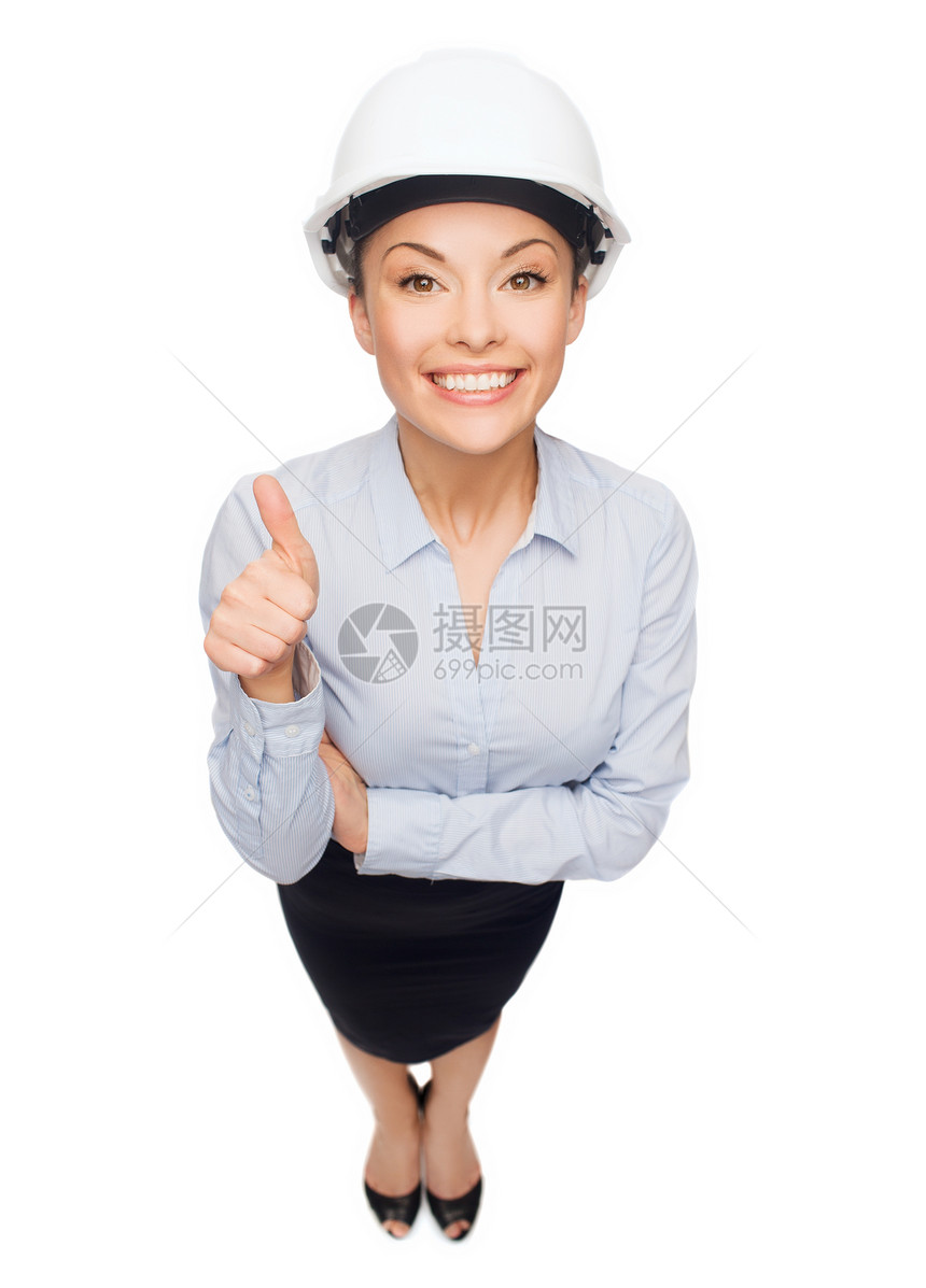 戴白头盔的女商务人士举起大拇指图片