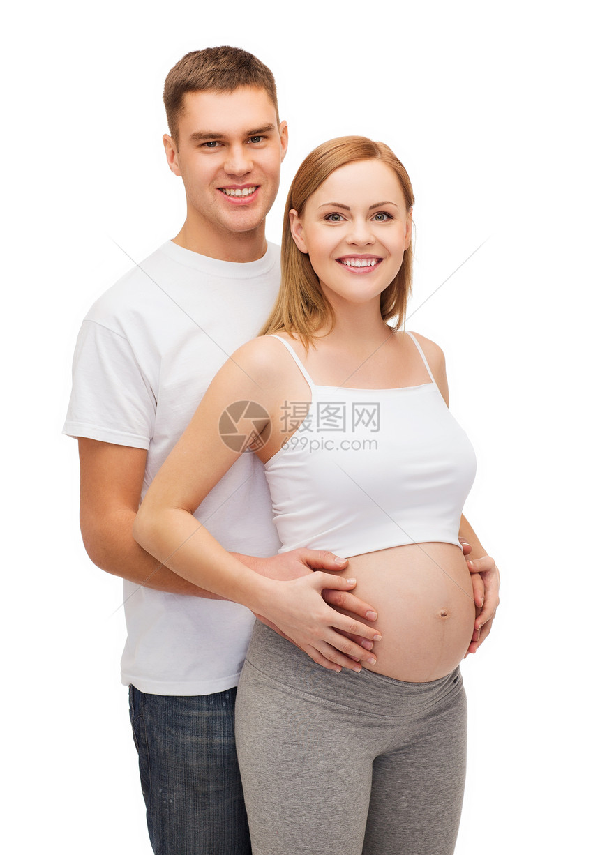 幸福的年轻家庭预产期子女女士母性母亲微笑怀孕男人生活父母肚子拥抱图片