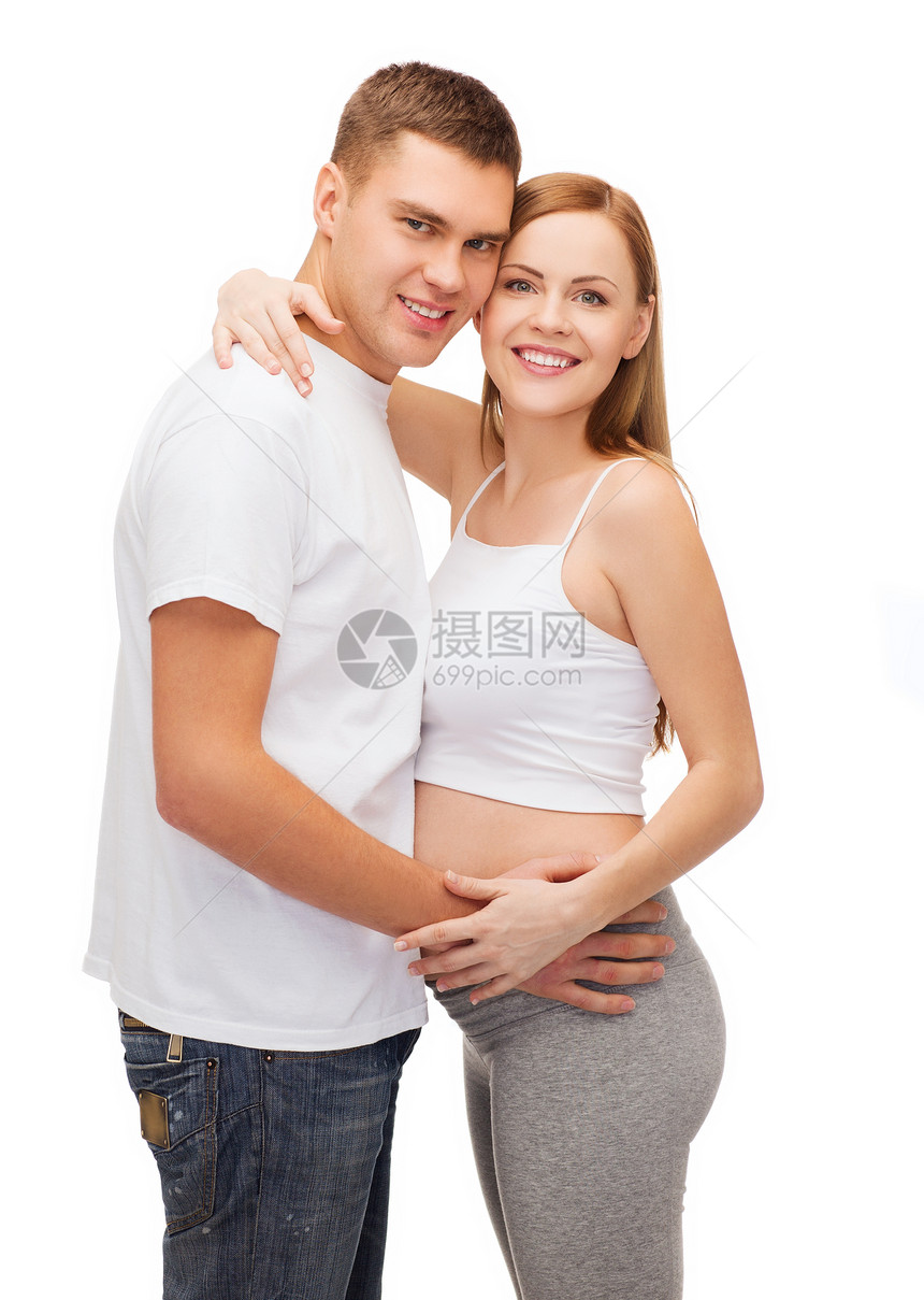 幸福的年轻家庭预产期子女丈夫肚子微笑身体女士妻子男性女性女孩父母图片