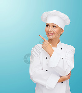 笑着的女厨师指着男儿助手职业广告女士白色食物女性微笑美食管理人员背景图片