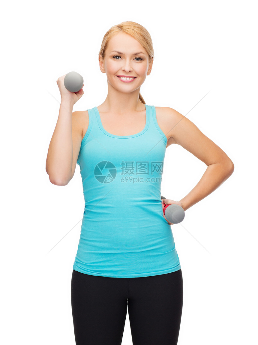 年轻运动女青年 有轻聋哑铃微笑重量运动装损失力量女孩饮食健康训练耐力图片