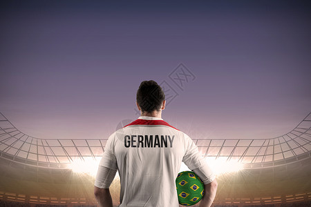 德国足球运动员的球手队杯子男性锦标赛聚光灯男人世界天空蓝色计算机球衣背景图片