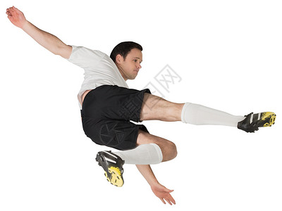 踢白脚足球运动员男人运动服黑色跳跃活动男性播放器运动白色齿轮背景图片