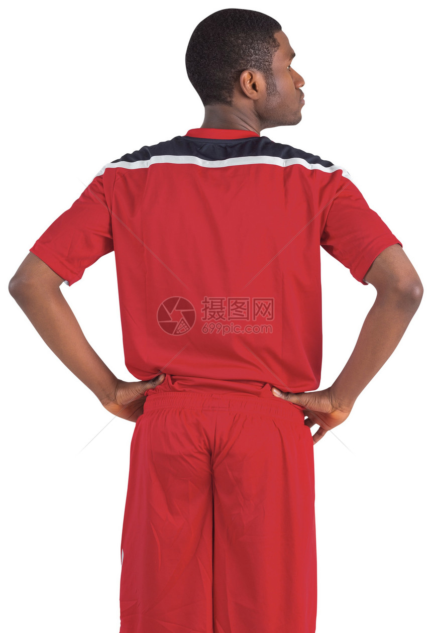 穿红球衣的英俊足球运动员播放器黑色活动运动服男性齿轮男人运动图片