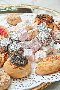 土耳其喜悦的甜点面团脚凳咖啡店盘子蜜饼开心果蜂蜜核桃坚果美食糖高清图片素材