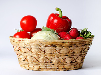 蔬菜篮菜篮子绿色蔬菜萝卜篮子红色背景图片