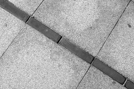 以简单模式显示的标志街道黑与白正方形路面线条灰色瓷砖大理石混凝土板背景图片