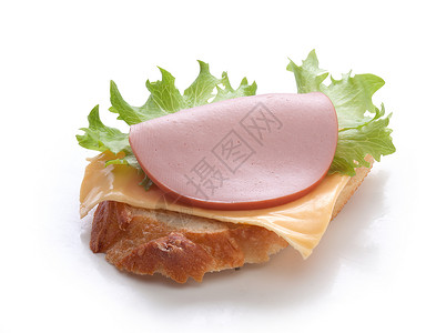 带香肠的三明治折叠医生生产白色波浪盘子绿色食物背景图片