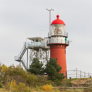 红灯塔红色海岸灯塔建筑学沙丘建筑背景图片