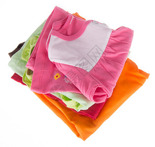背面的婴儿衣着女孩织物毛衣母性裙子新生粉色孩子折叠白色背景图片