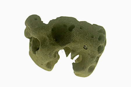 由海生物制造的岩洞石头卵石岩石矿物背景图片