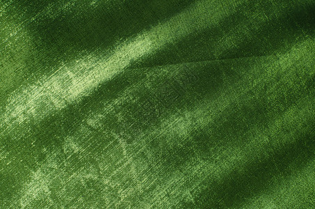 绿色丝织材料丝绸织物金子奢华布料背景图片