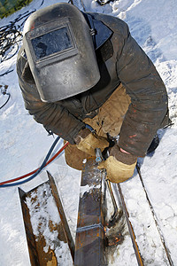 工业工人手套技术棕色焊机面具眼镜机械衣服工具金属背景图片