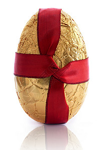 黄金东部蛋金子巧克力红色丝绸食物丝带糖果展示挫败礼物背景图片